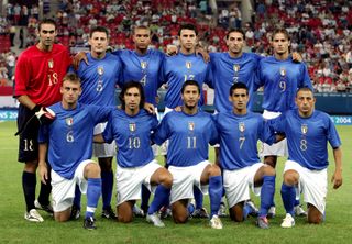 Italy players pose for a photo at the 2004 Olympics in Athens.