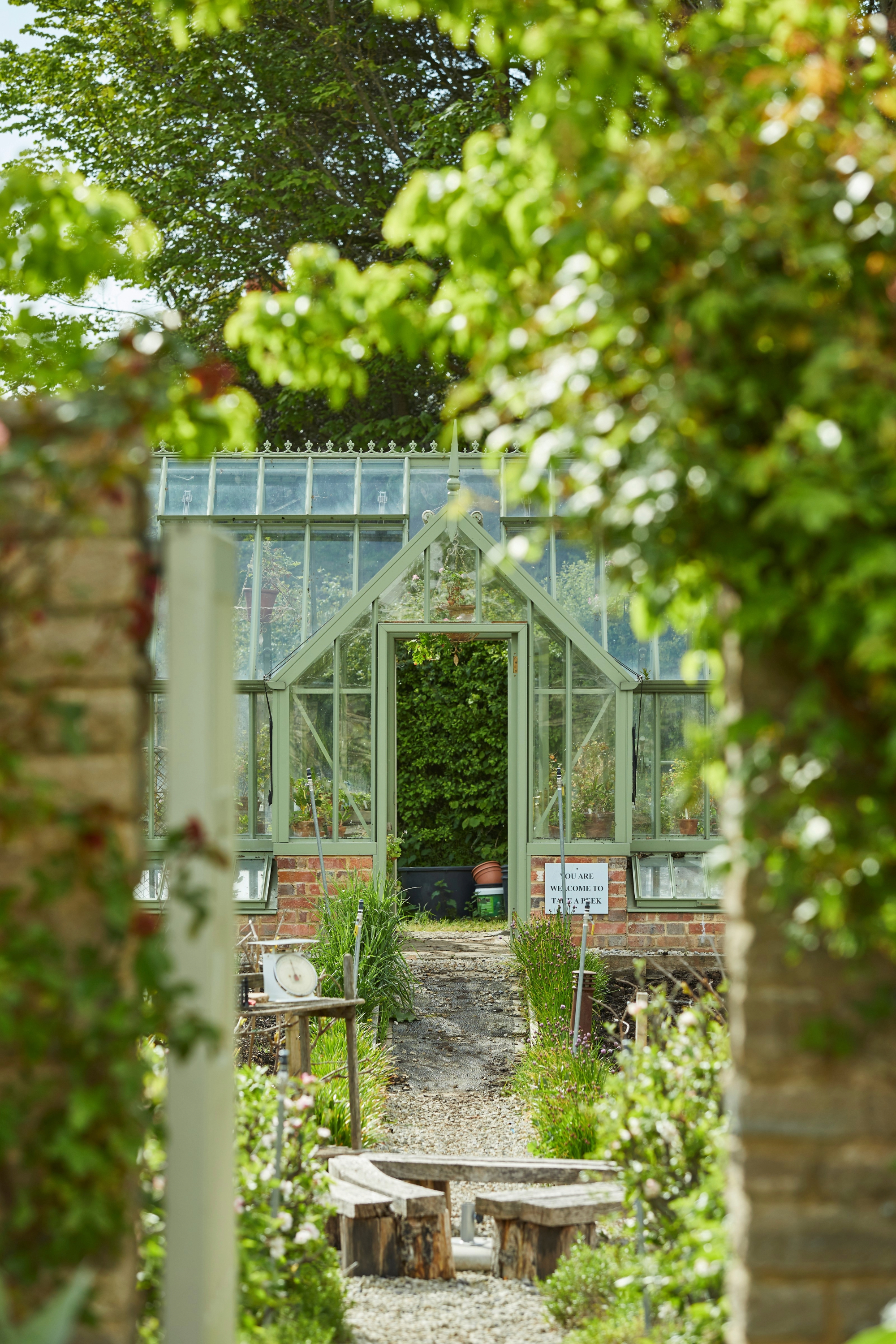 An example of a glasshouse in a garden from designer Alitex.