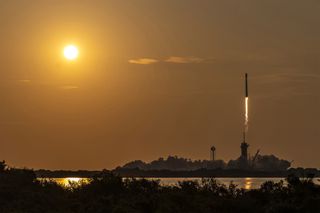 rocket launching into the sky with the sun shining nearby