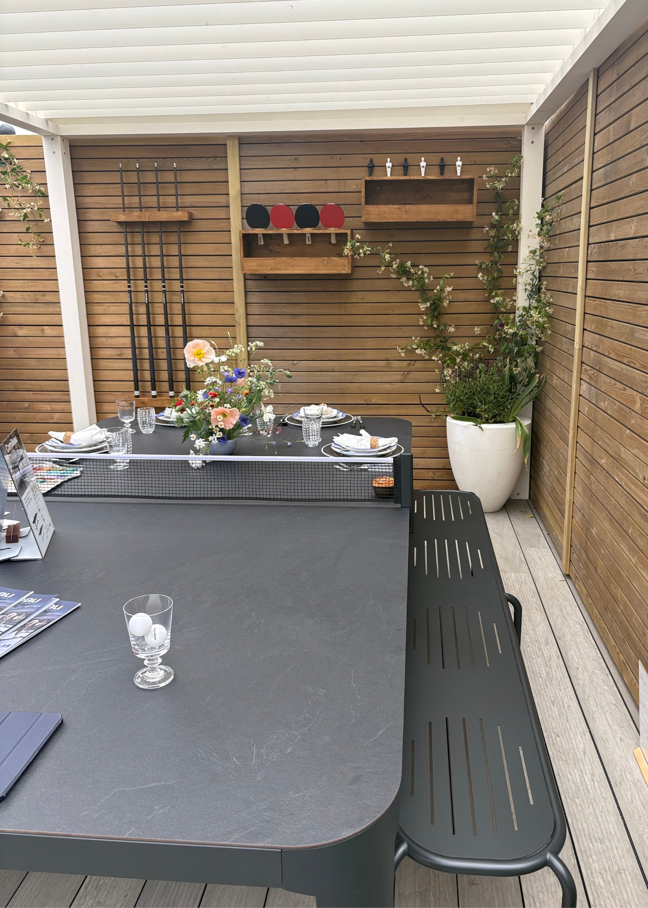 An outdoor dining table that doubles as a ping pong table at the Chelsea Flower Show 2026