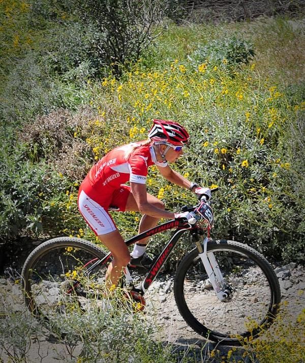 Lene Byberg (Specialized) riding through the flowers.