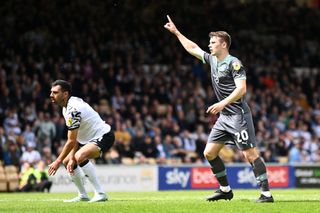 Adam Randell of Plymouth Argyle celebrates after scoring the team's first goal during the Sky Bet League One between Port Vale and Plymouth Argyle at Vale Park on May 07, 2023 in Burslem, England.