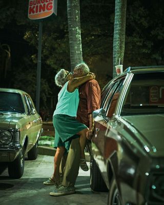 Image of an elderly couple kissing from a Burger King ad campaign