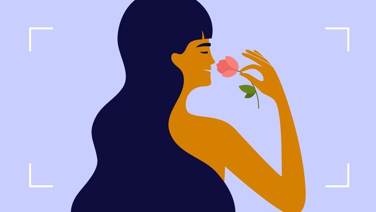 Illustration of a woman with flowing hair smelling a rose to illustrate using rosewater for hair