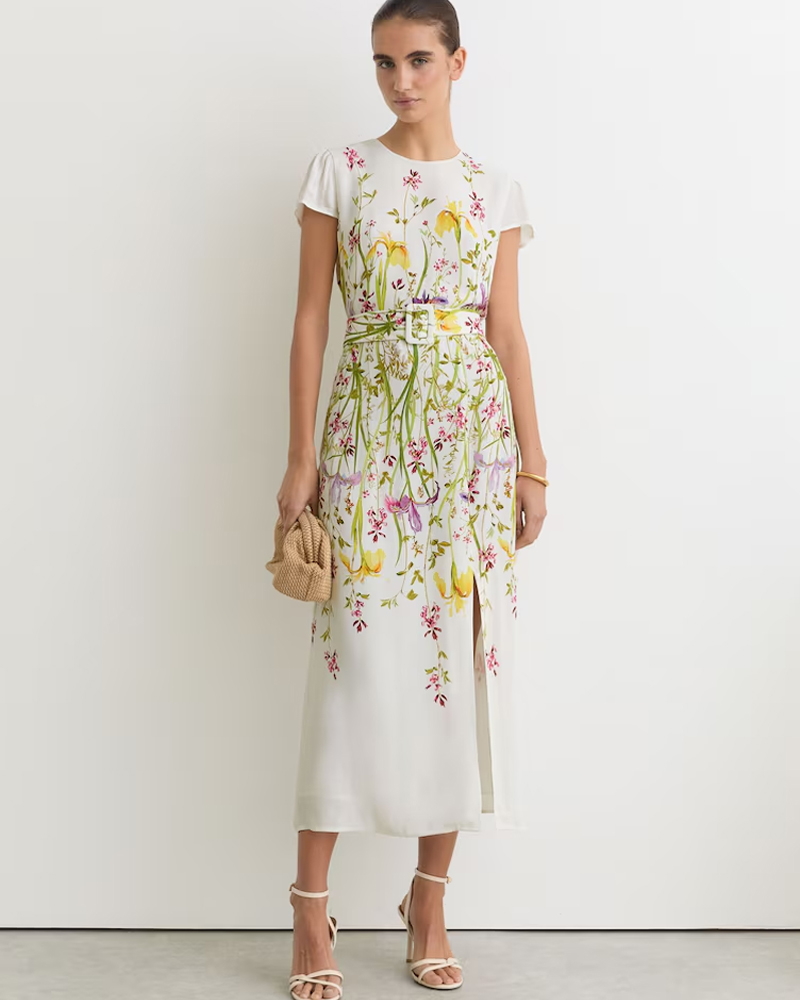 model wearing a belted floral midi dress
