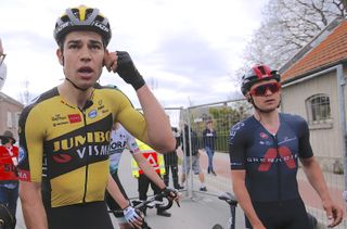 Wout van Aert and Tom Pidcock look on as they wait to find out who won the 2021 Amstel Gold Race