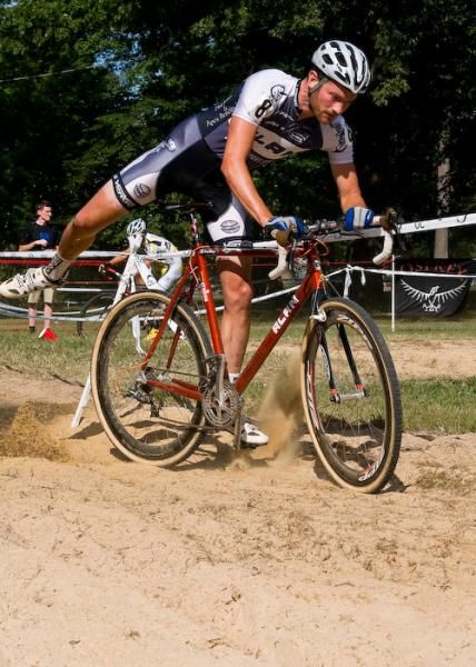 Greg Wittwer (Alan Cycling Team) dismounts in the sandpit.