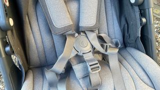 a photo of the harness on the Ergobaby Metro+ Deluxe Stroller
