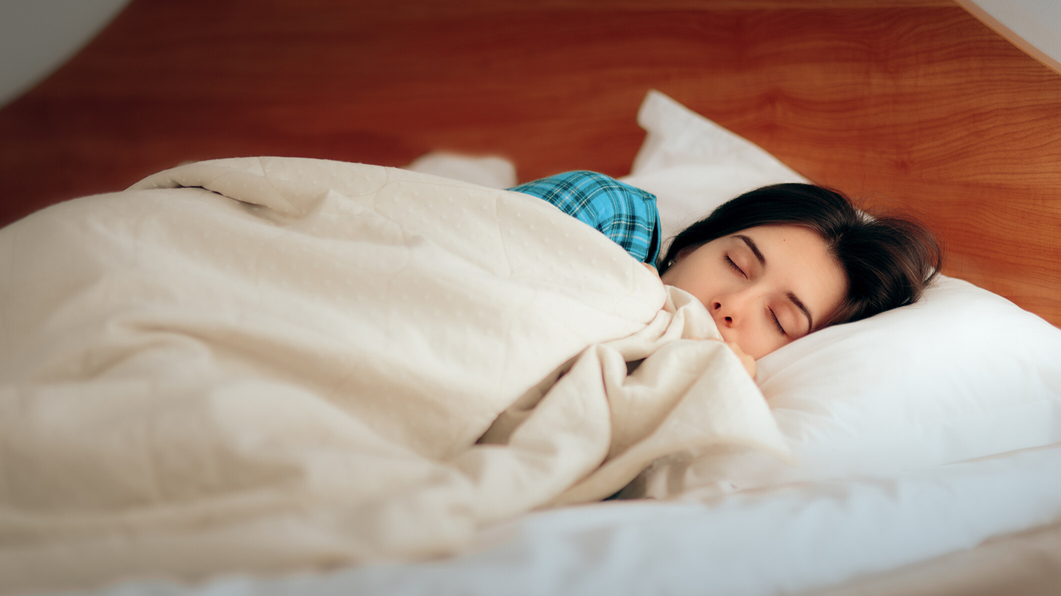 Woman sleeping with a cotton sheet