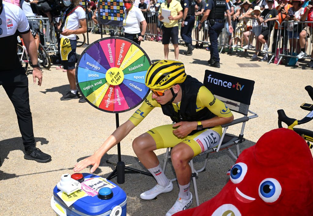 GAP FRANCE JULY 18 Tadej Pogacar of Slovenia and UAE Team Emirates Yellow leader jersey plays a game prior to the 111th Tour de France 2024 Stage 18 a 1795km stage from Gap to Barcelonnette 1134m UCIWT on July 18 2024 in Gap France Photo by Dario BelingheriGetty Images