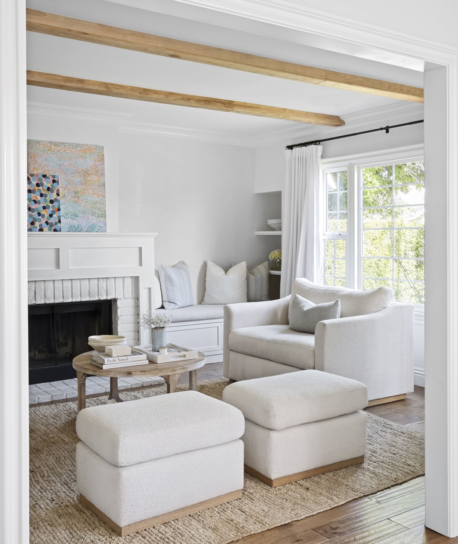 White living room with cream couch by Victoria Holly Interiors