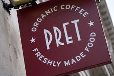 Pret signage hanging from a wall
