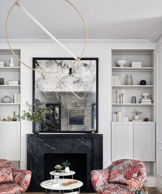Living room ceiling light ideas with a gold hoop fixture featuring an LED bar across the center