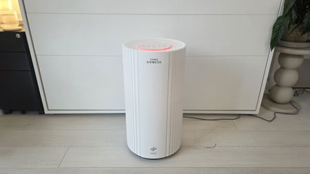 The Coway Airmega 350 from the front, showing off its whole body and multicolor lighting.