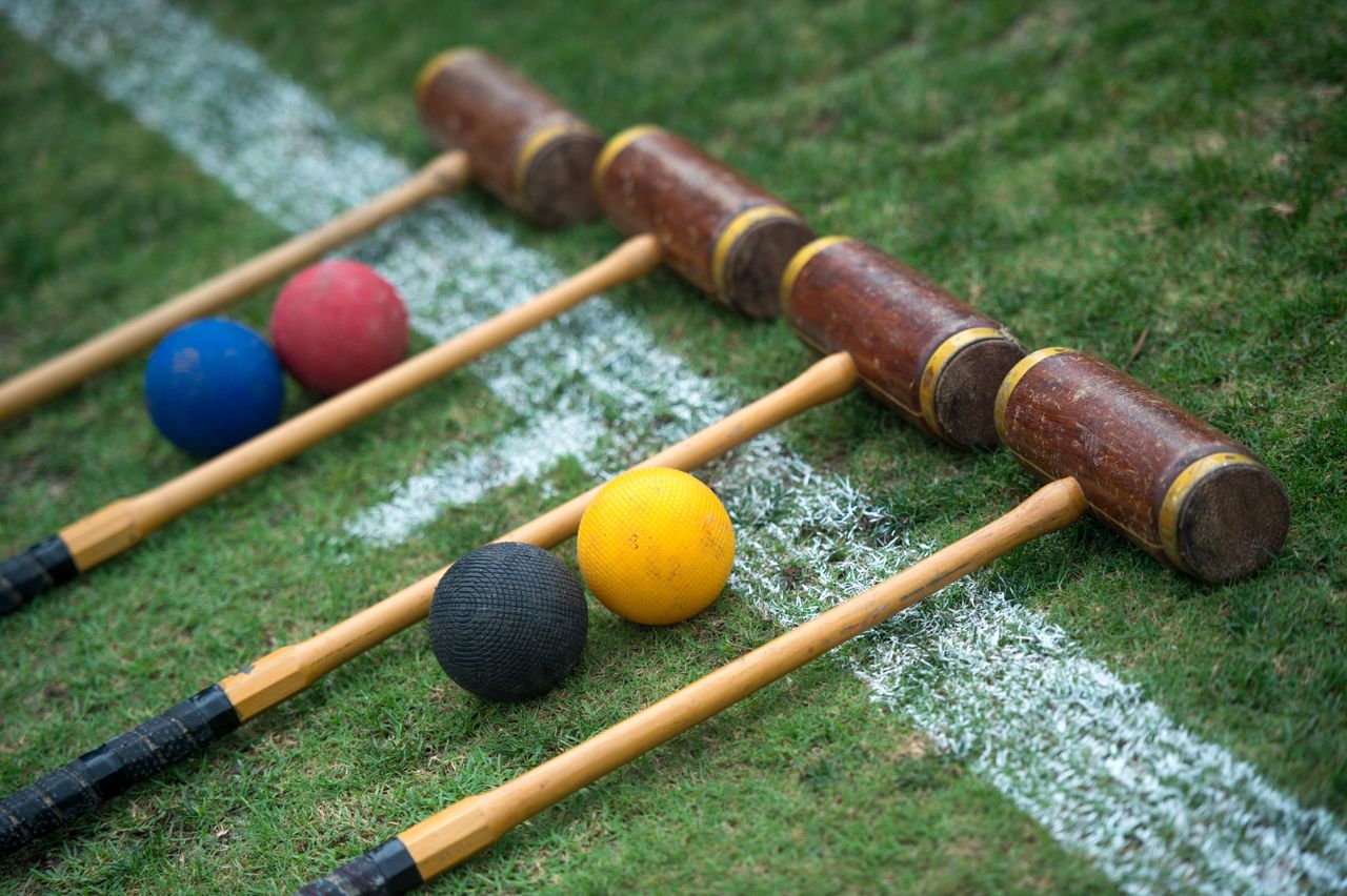 Croquet set laid out ready to play, croquet mallets and balls.Jayne Russell / Alamy Stock Photo