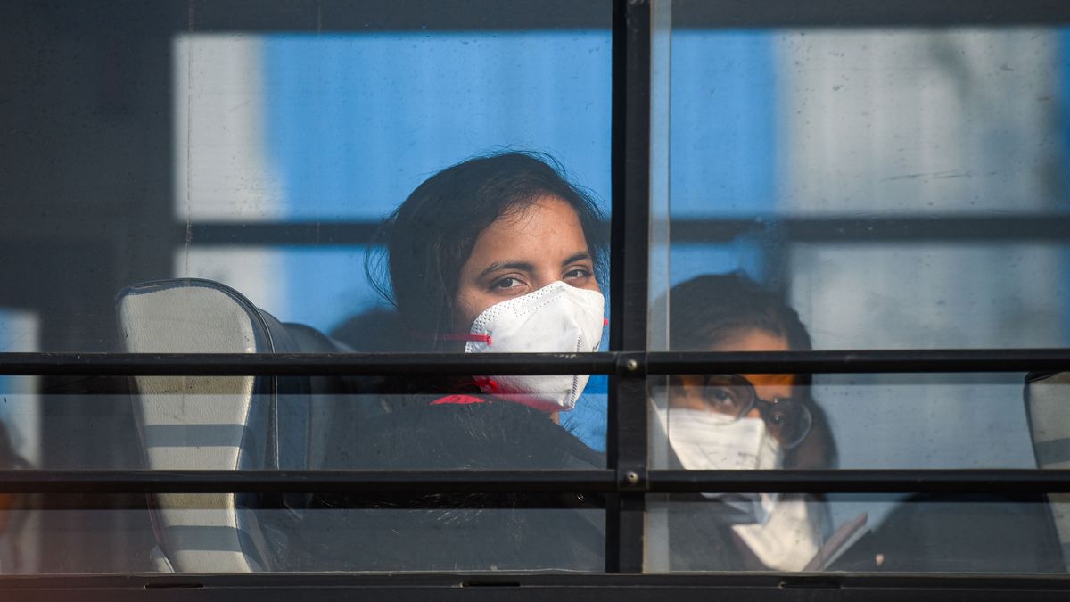 Students are taken to a special army facility as a precaution against the possible coronavirus infection on their return from China, at Indira Gandhi International Airport, on Feb. 1, 2020 in New Delhi, India. The passengers were evacuated from Wuhan and will be kept in isolation for 14 days in Chhawla in Delhi.