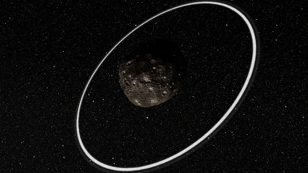 Tiny, unseen moon could be holding bizarre space rock Chariklo’s rings in place Space