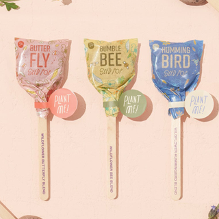A trio of lollipop-shaped seed packs for different pollinators