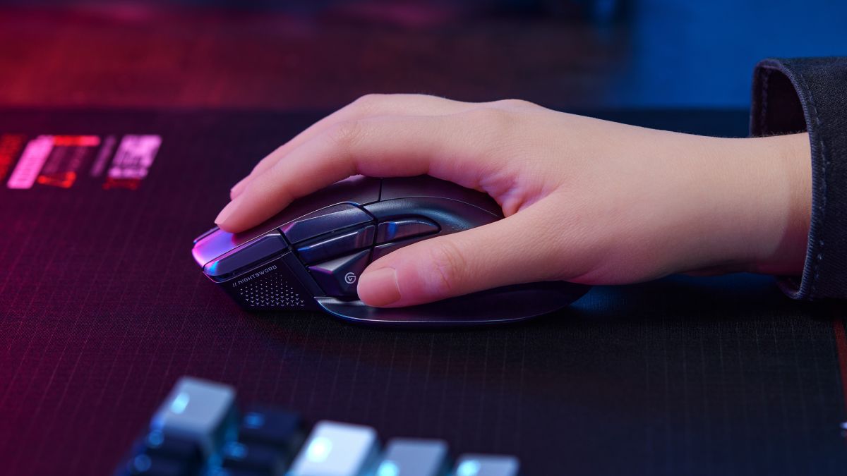 Corsair Nightsword V2 wireless gaming mouse with built-in Stream Deck button on a black desk
