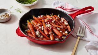 Le Creuset Red cast iron skillet cooking carrots