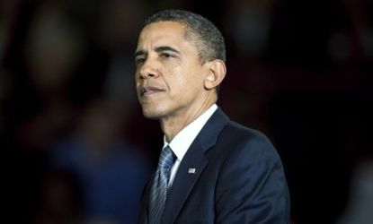 President Barack Obama pauses during an economic speech in Kansas in which he invoked the legacy of Republican President Teddy Roosevelt, who focused relentlessly on the middle class.