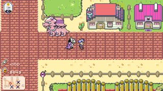 Best Pokémon games - Monster Crown - A player and their monster companion walk through a small town together.