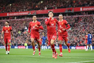 Curtis Jones of Liverpool celebrates scoring his team&#039;s second goal during the Premier League match between Liverpool FC and Chelsea FC at Anfield on October 20, 2024 in Liverpool, England.