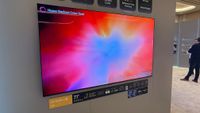 A wall mounted LG C6 OLED TV at LG's CES 2026 booth