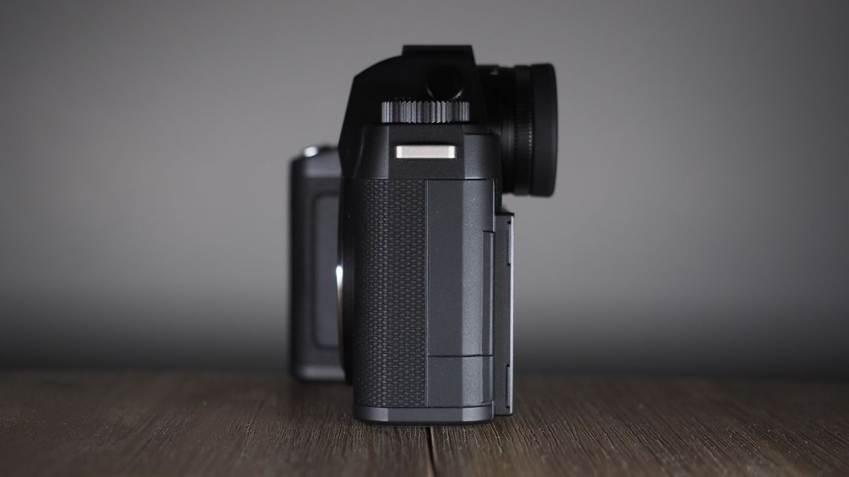 Leica SL3-S on a wooden surface with moody lighting
