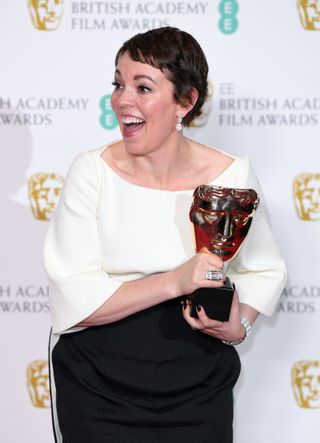 Olivia Colman, pictured in the future, with one of the 73 awards she'll win in 2020. Or it might have been from the 2019 Baftas. Who can tell? (Credit: Karwai Tang/WireImage)