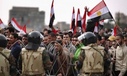 Anti-government protesters pile into Tahrir Square Friday for what they have dubbed the "day of departure," despite President Mubarak's refusal to stand down.