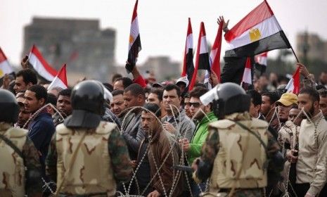 Anti-government protesters pile into Tahrir Square Friday for what they have dubbed the &amp;quot;day of departure,&amp;quot; despite President Mubarak&amp;#039;s refusal to stand down.