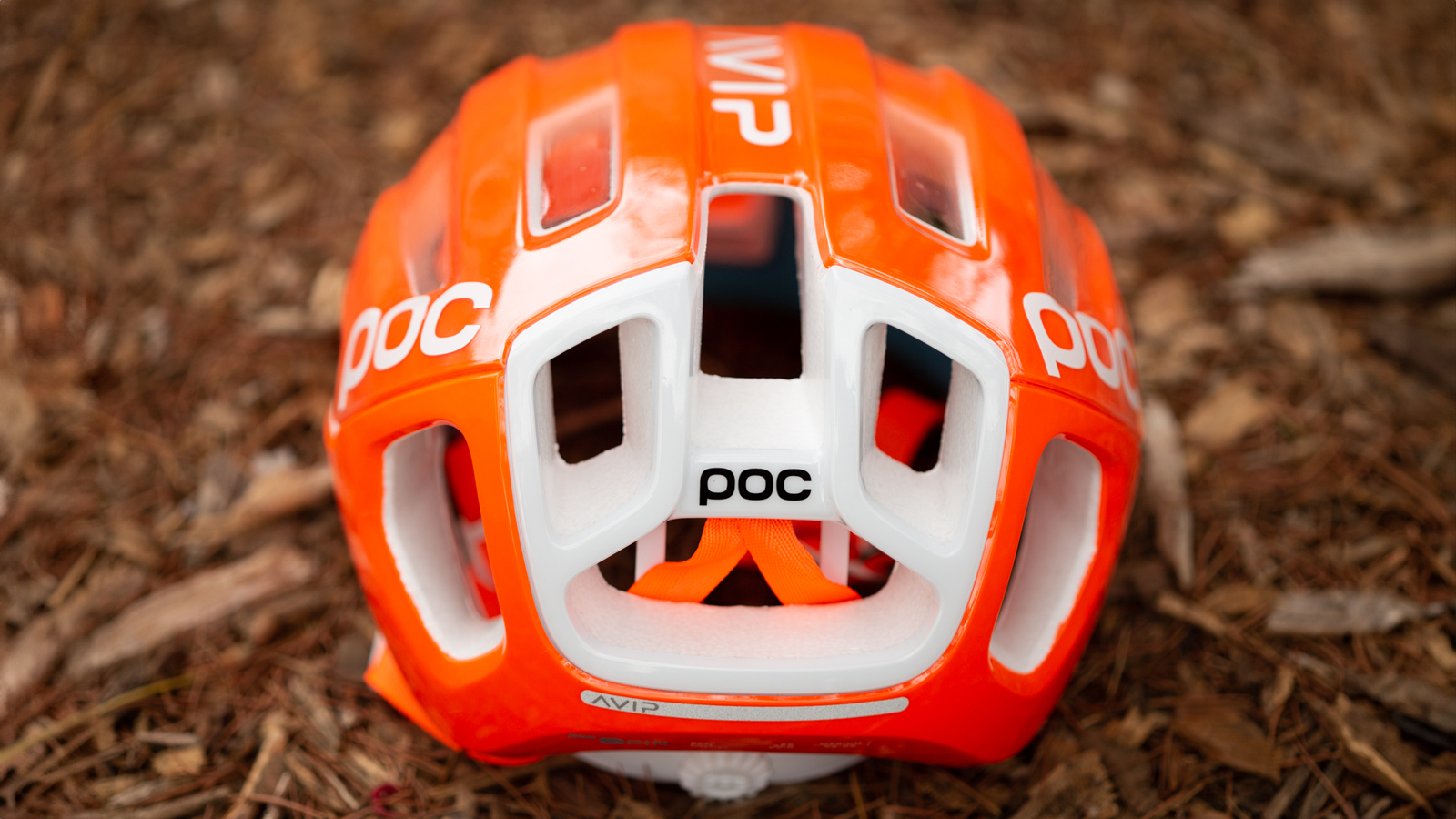A rear view of an orange and white helmet