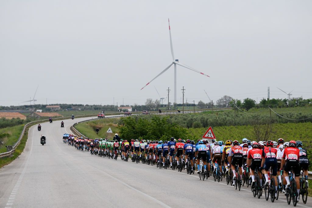 MELFI ITALY MAY 08 A general view of the peloton passing through a windmill farm landscape during the 106th Giro dItalia 2023 Stage 3 a 213km stage from Vasto to Melfi 532m UCIWT on May 08 2023 in Melfi Italy Photo by Tim de WaeleGetty Images