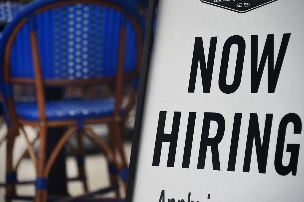 A restaurant displays a &amp;quot;Now Hiring&amp;quot; sign amid the coronavirus pandemic, on August 4, 2020 in Arlington, Virginia.