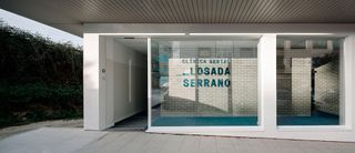 The name Losada Serrano is set in the same petroleum colour of the interior textile vinyl flooring