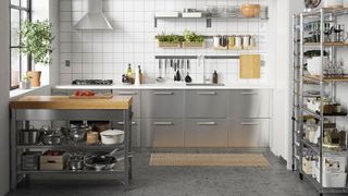 small kitchen with stainless steel units to show how to organize a small kitchen a