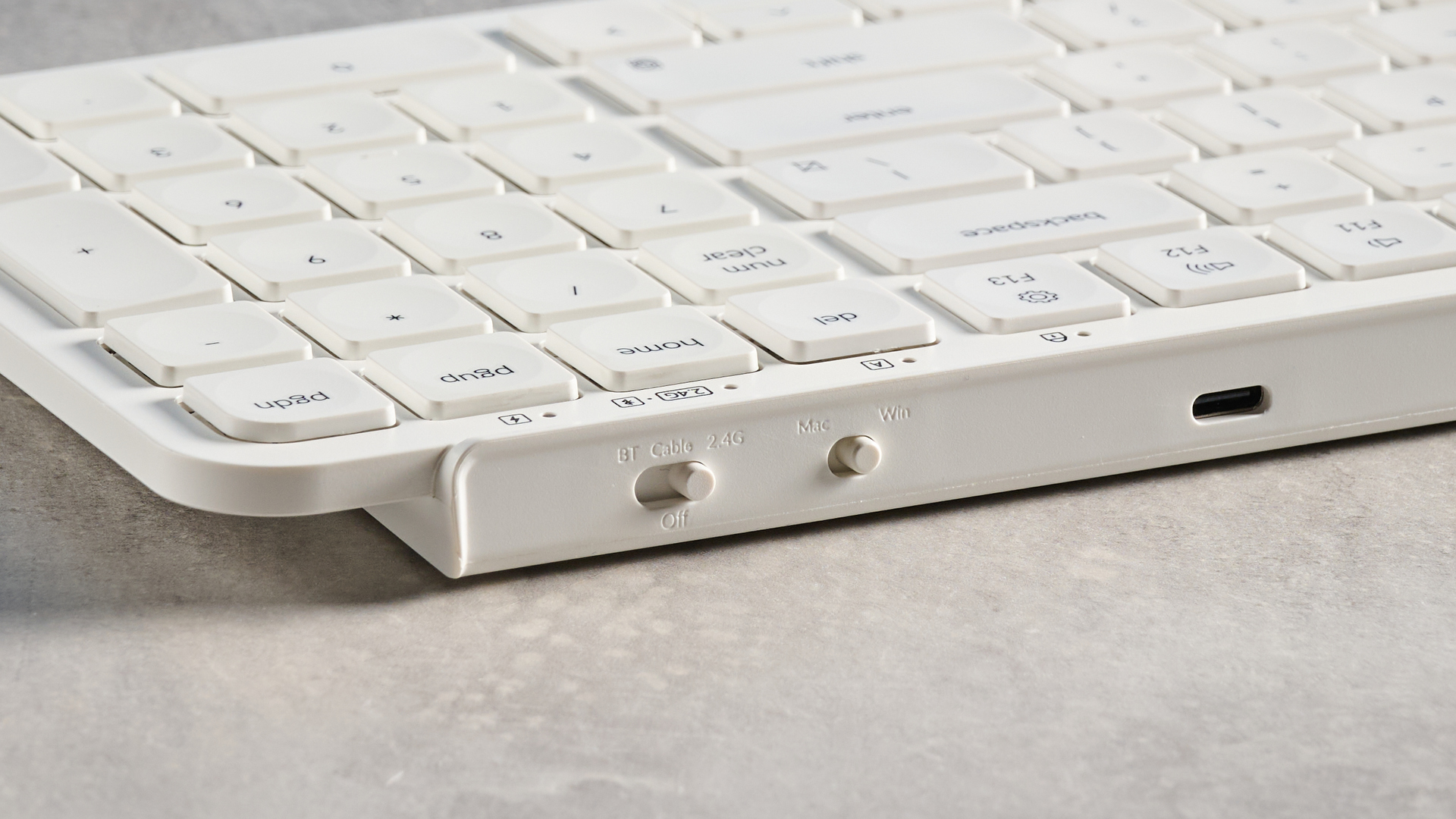 Keychron B2 Pro ultra-slim low profile keyboard in white photographed on a grey background.