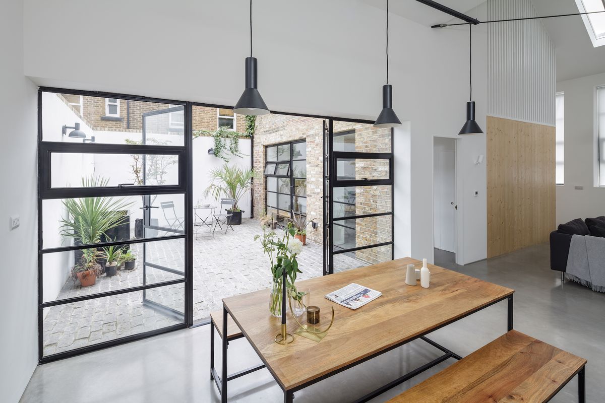 A simple palette of raw materials helps to achieve the minimalist loft look in this conversion project.