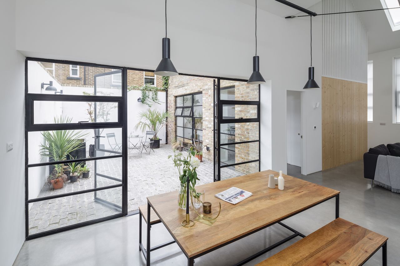 A simple palette of raw materials helps to achieve the minimalist loft look in this conversion project.