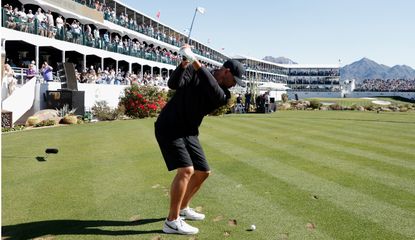 Koepka hits a tee shot