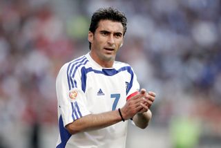 Theodoros Zagorakis applauds during Greece's Euro 2004 final against Portugal in July 2004.