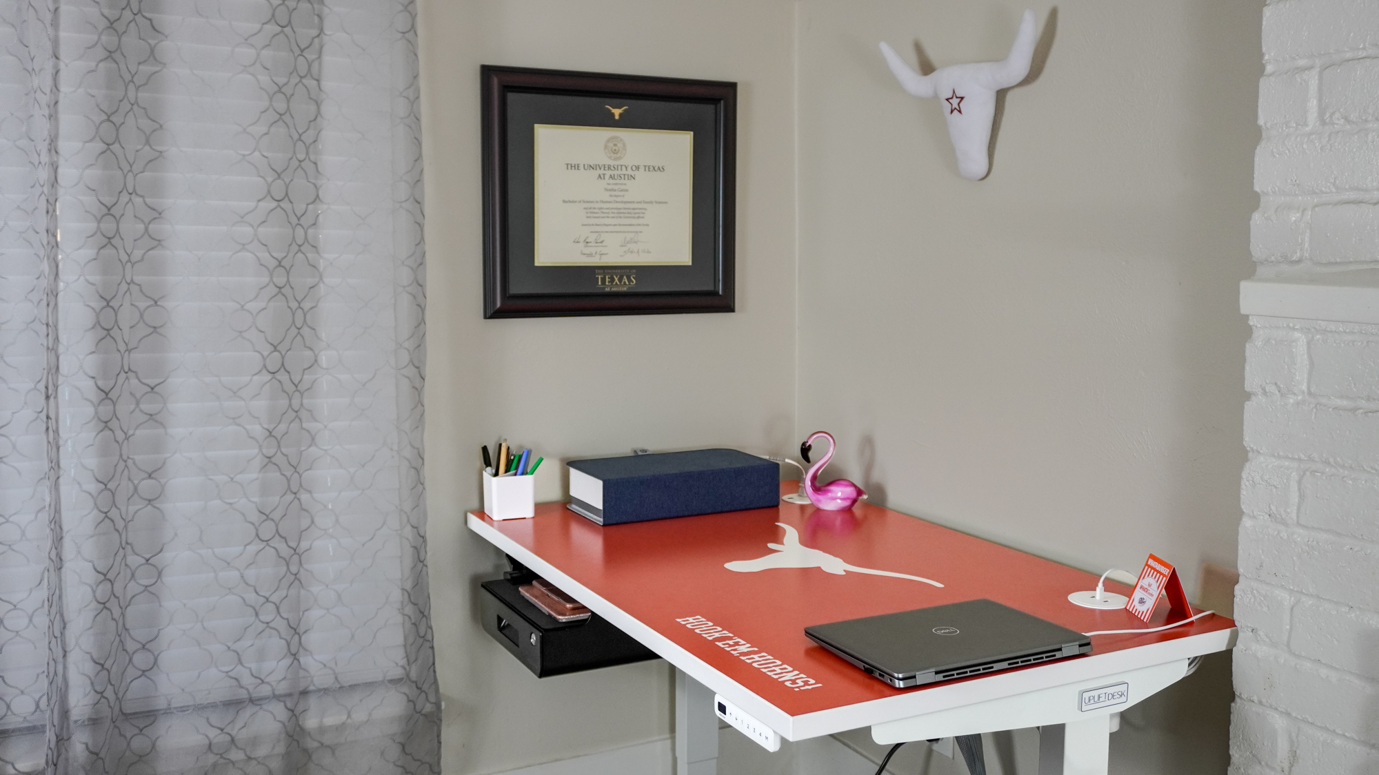 A side view of a desk setup built around a University of Texas desk from the new Uplift Desk Collegiate Collection