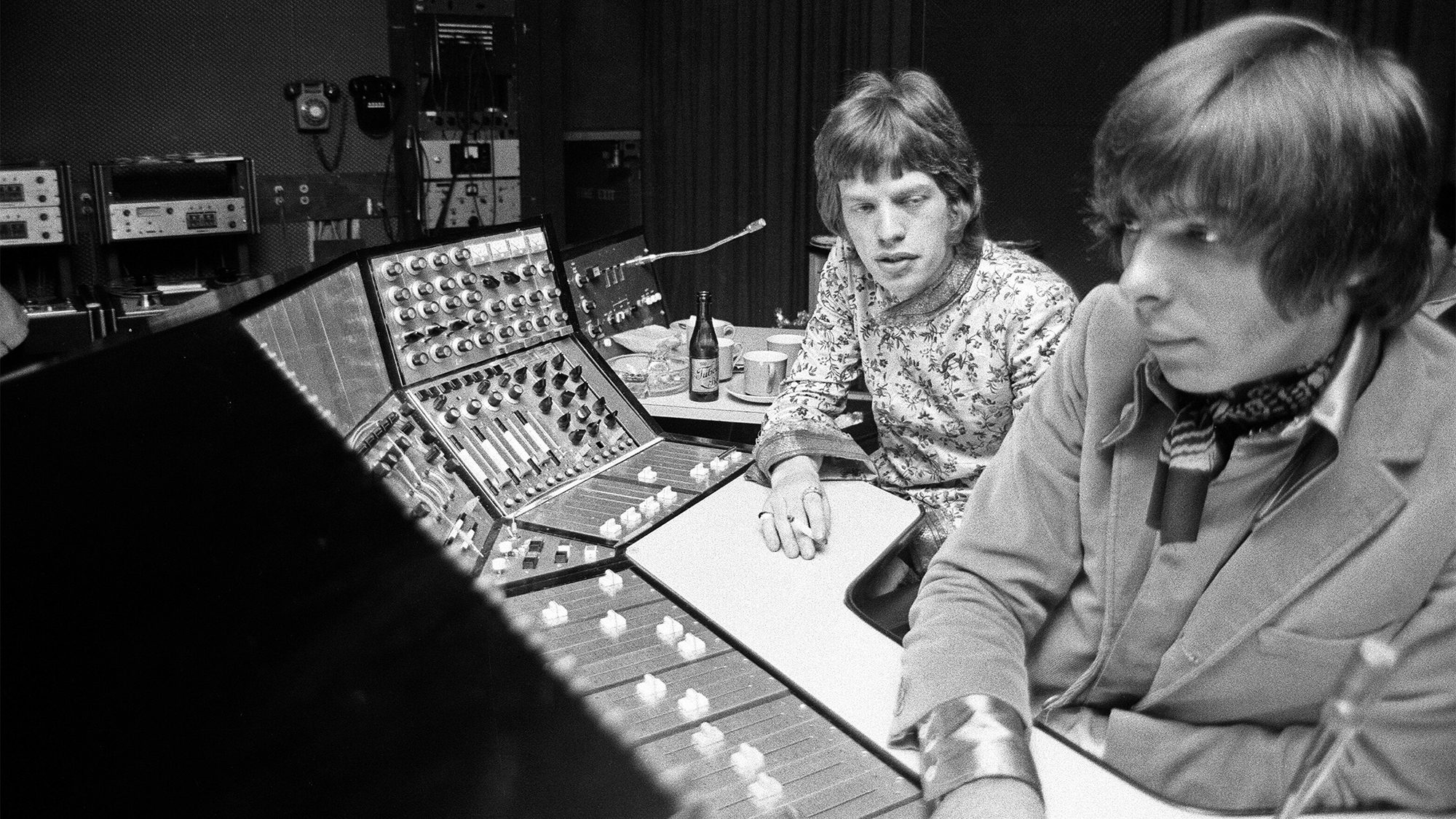 The Rolling Stones at Olympic Recording Studio in Barnes, south west London recording backing for the track &#039;We Love You&#039; Mick Jagger and engineer Glyn Johns in the control room. 19th May 1967