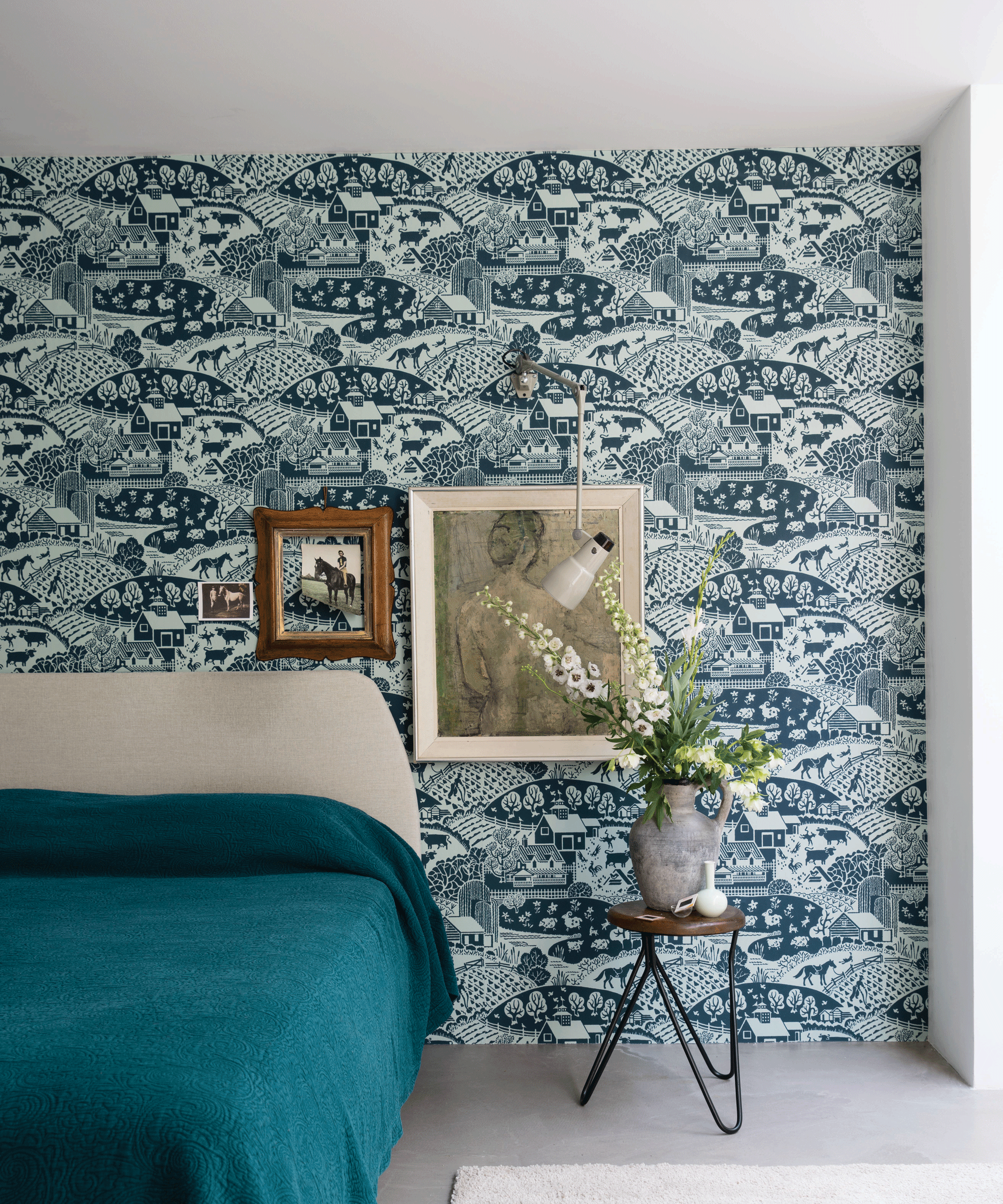 Bedroom with blue patterned wallpaper