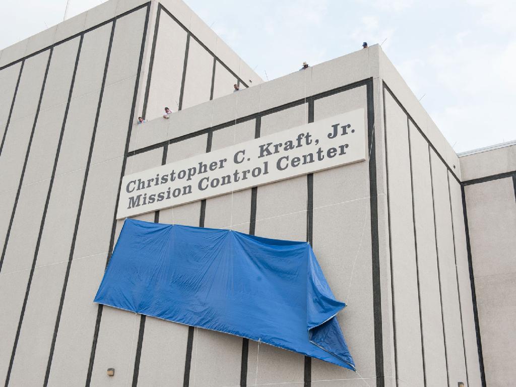 After more than 45 years of service to the nation&#039;s space program, the naming for NASA&#039;s mission control center became official with the unveiling of a new nameplate on the building, designating the legendary building as the Christopher C. Kraft, Jr., Mis