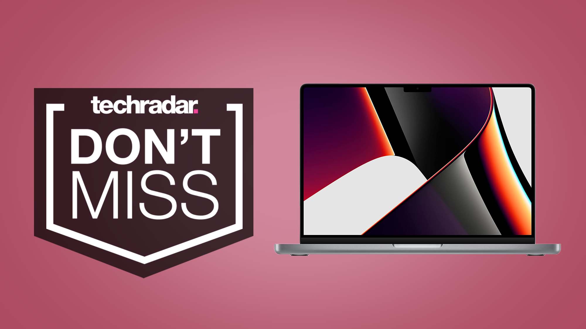 A MacBook Pro 14-inch against a pink background with a TechRadar Don't Miss badge