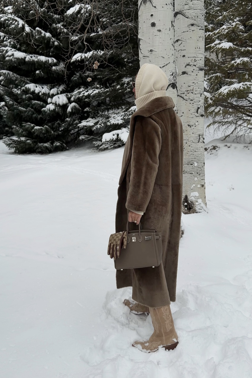 Bettina Looney wearing fur jacket in the snow