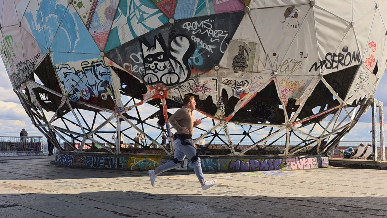 Running while wearing an AI-assisted exoskeleton.