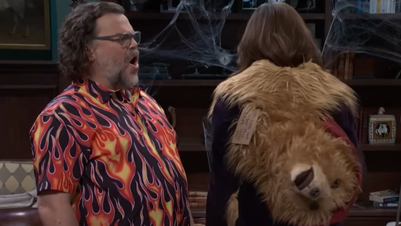 Tina Fey turns around to reveal a jacket with Paddington Bear's head on the back of it.